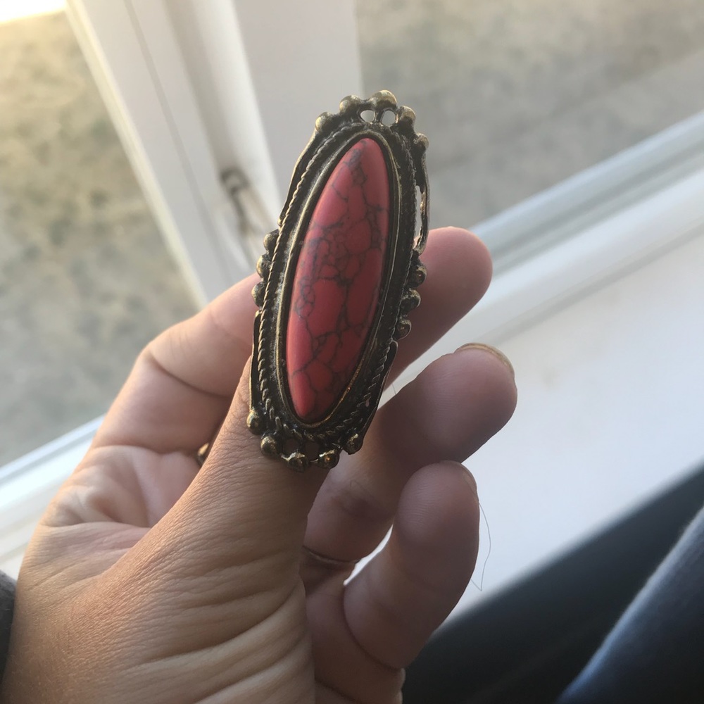 Ring with a cool stone entire knuckle
